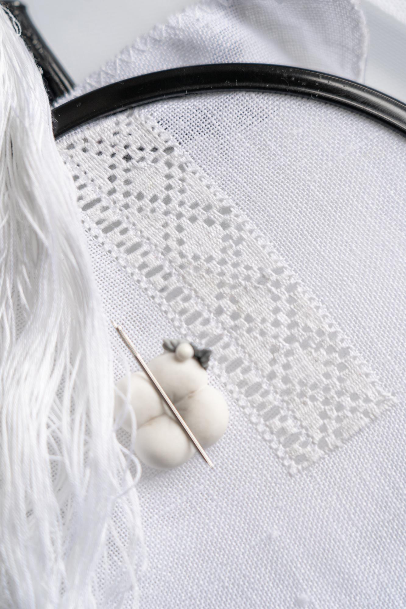 Detail of embroidered linen with geometric pattern